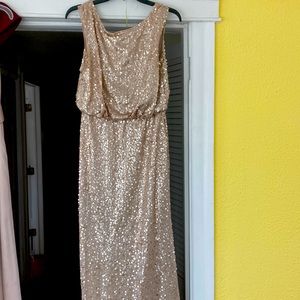 Full length sequin gown. Flattering waistline, V back.